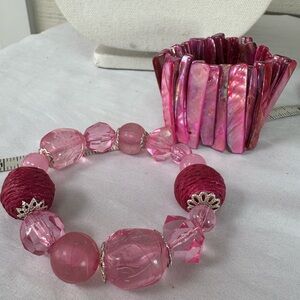 Two pink stretch style bracelets